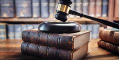 Judge gavel and law books in court, law and justice background concept